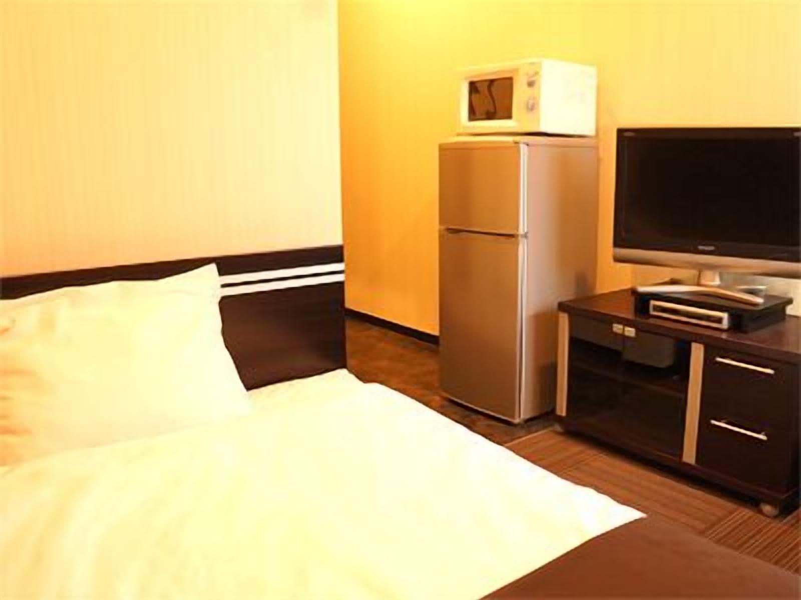 Hotel Livemax Budget Esaka Suita Esterno foto