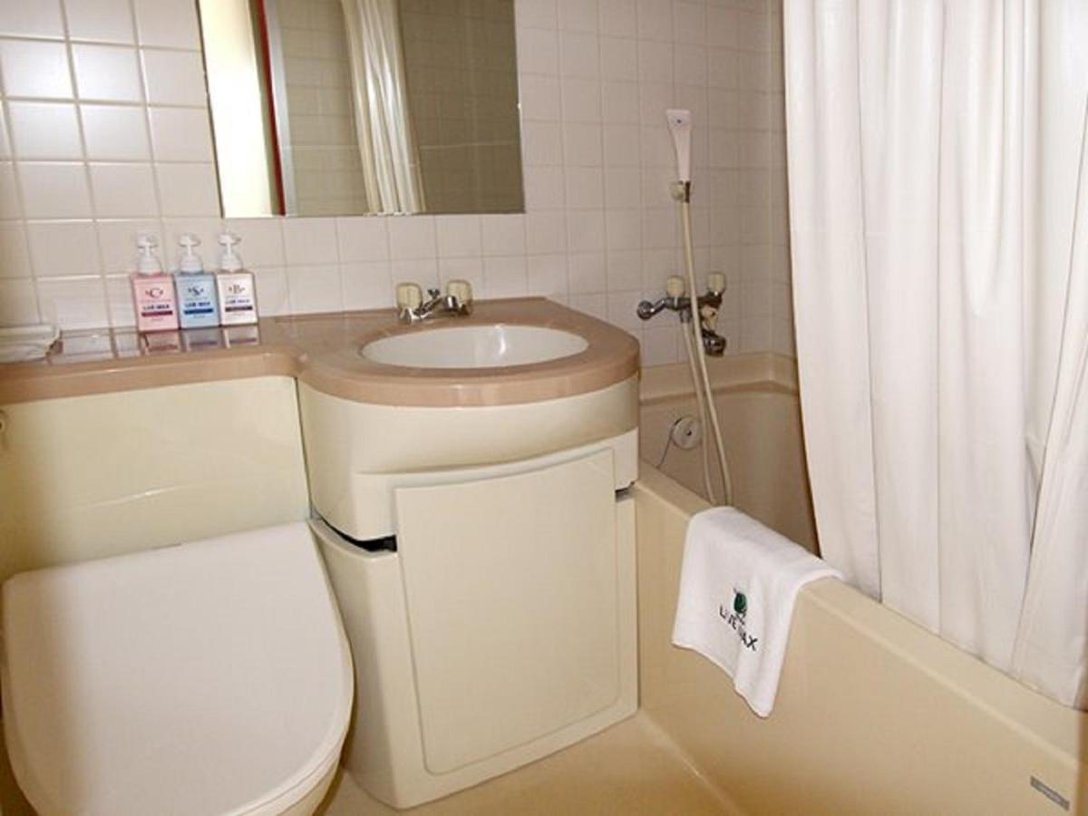 Hotel Livemax Budget Esaka Suita Esterno foto